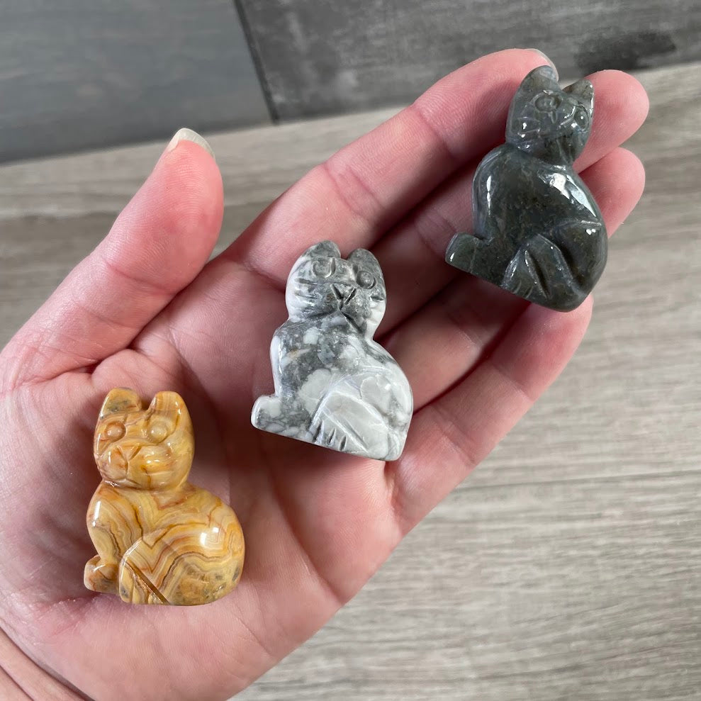 Wholesale crystal cat figurines in assorted gemstones for gift shops and metaphysical stores.