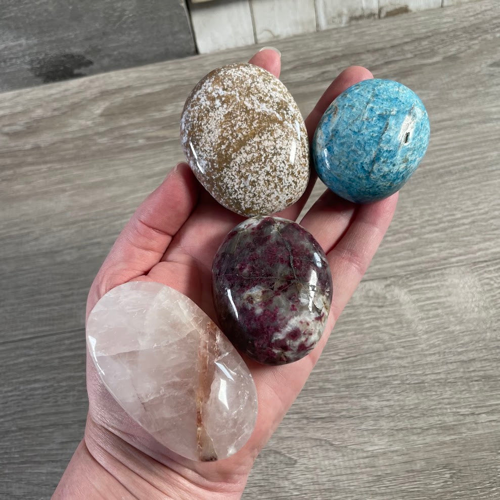 Bulk crystal palm stones with polished finishes for meditation and gemstone retail stores