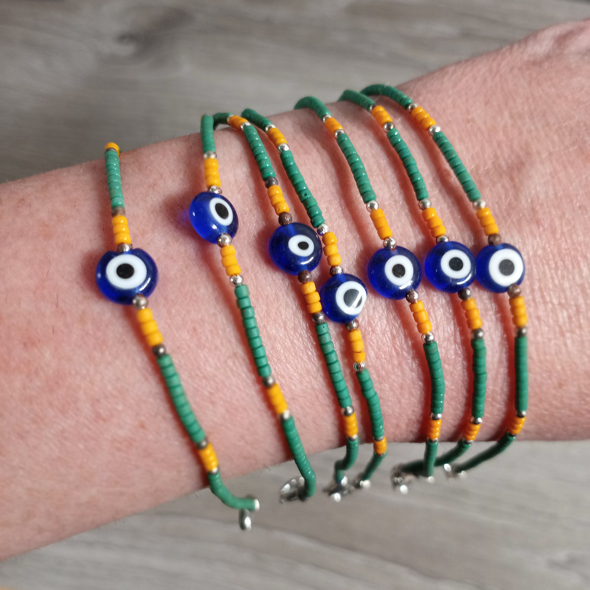 Boho wooden bracelet with blue evil eye charm wholesale