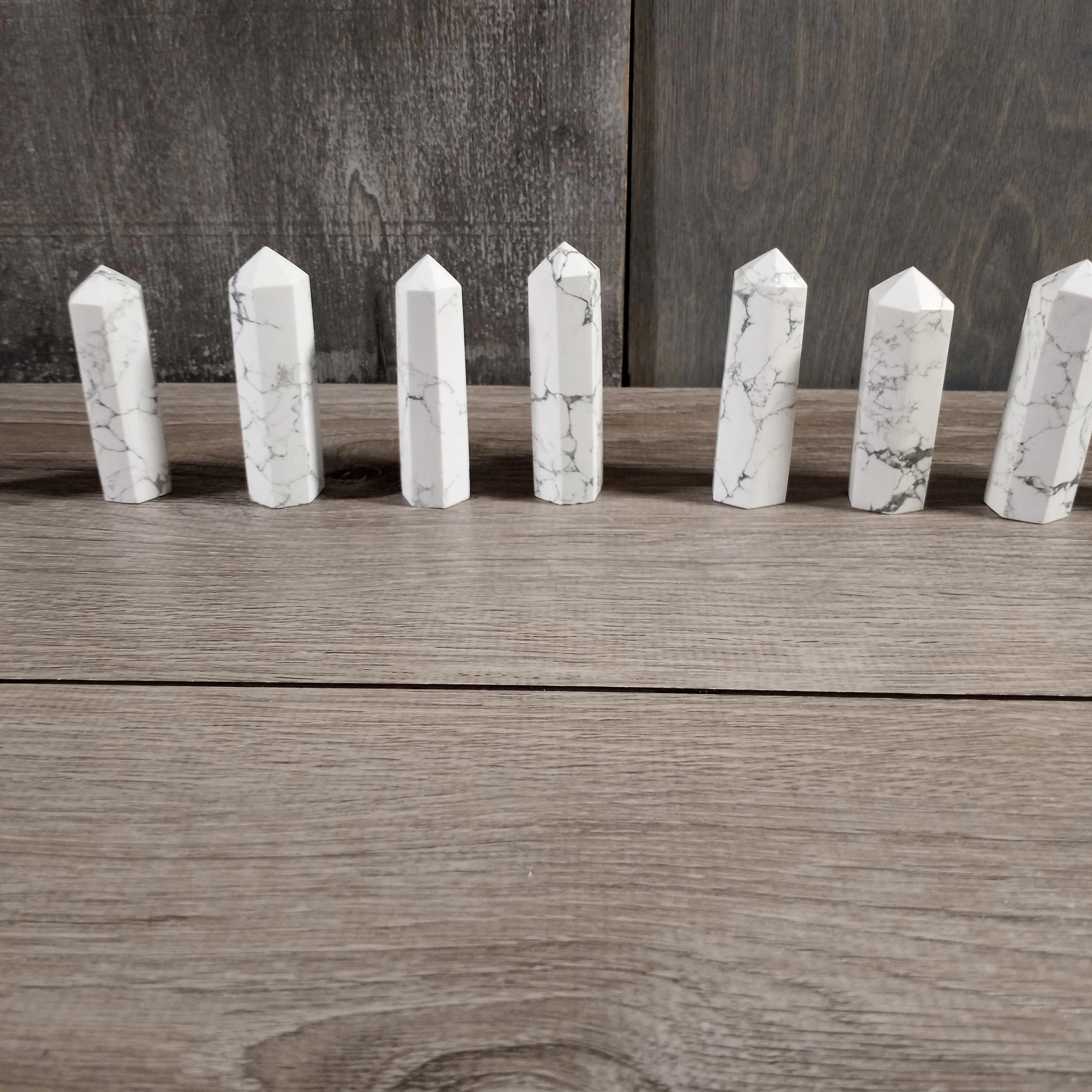 Howlite or white turquoise obelisks for resale.