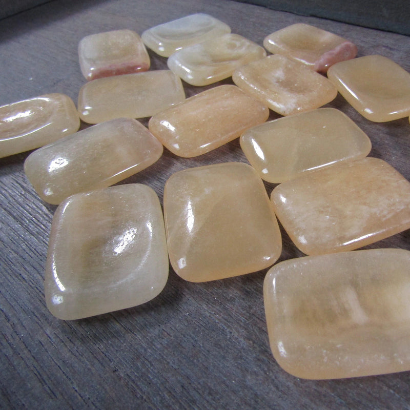 Orange calcite rectangle worry stone for community