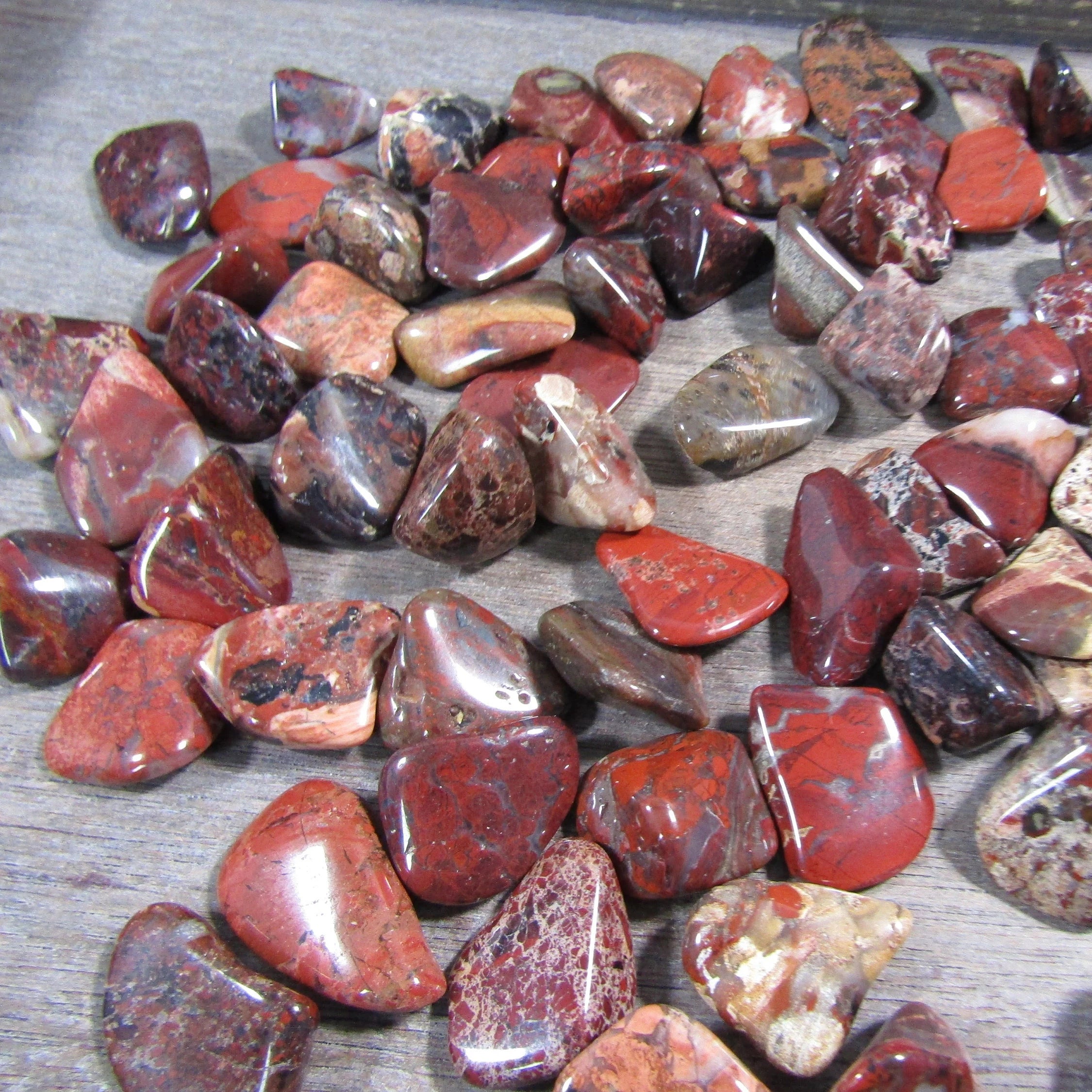 Pile of brecciated red jasper stones by the pound for wholesale purchase.