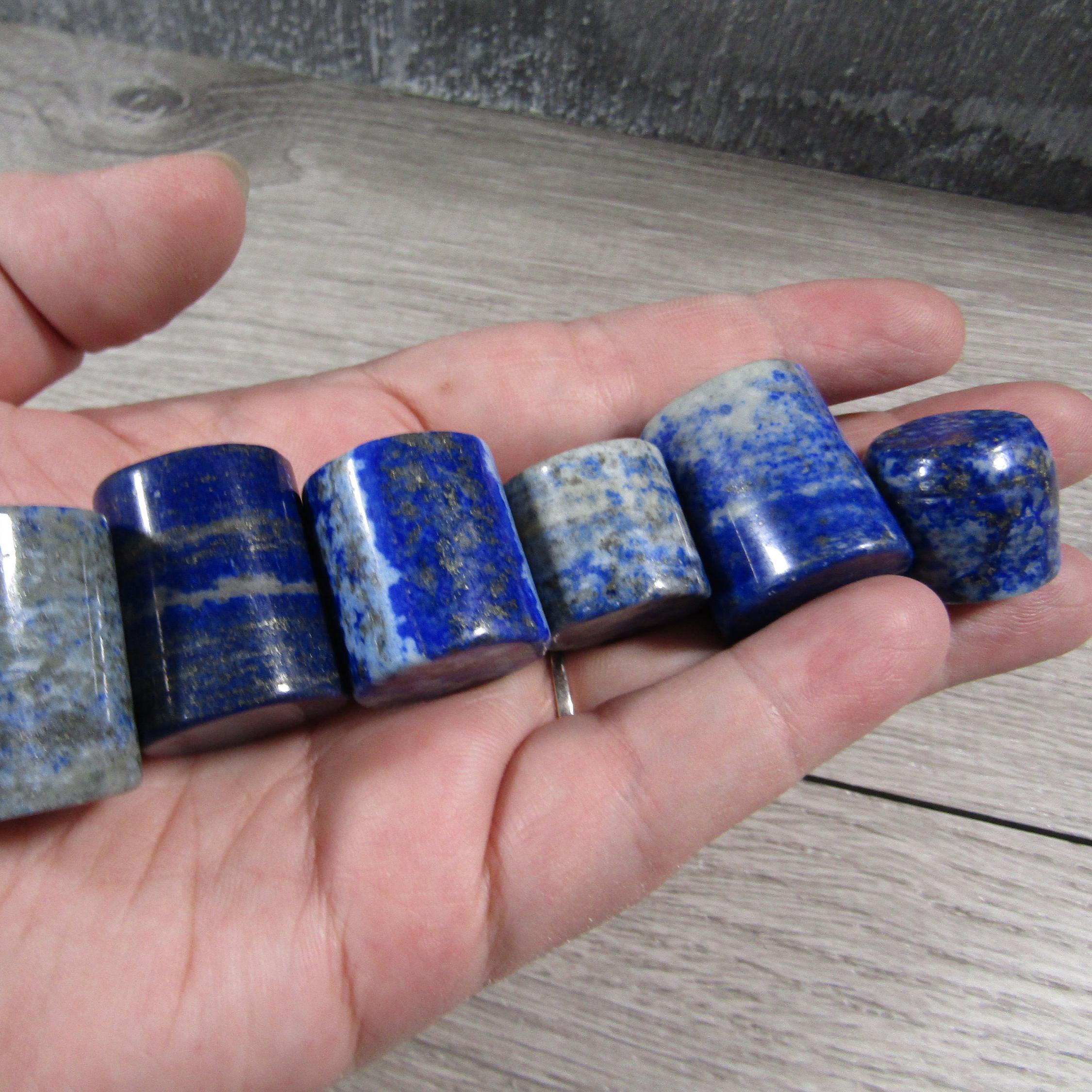 Lapis lazuli cylinder shape with deep blue hues and golden pyrite flecks