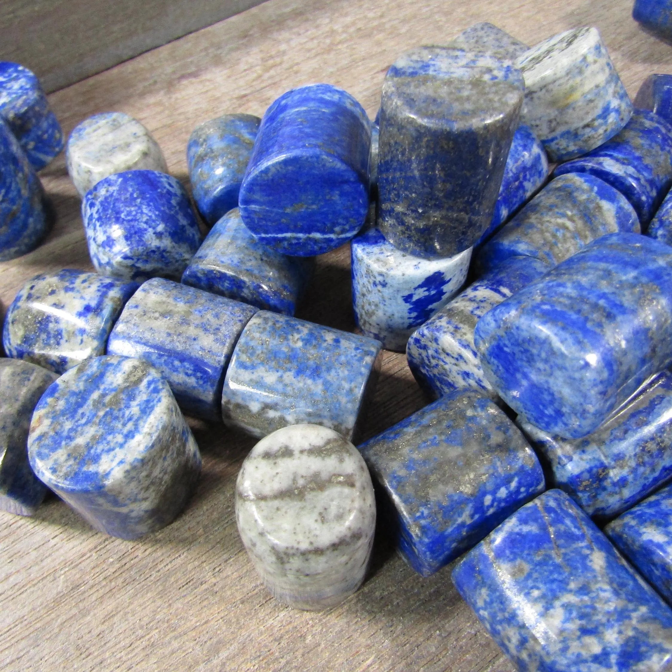 Polished lapis lazuli column shape crystal for energy work and décor.