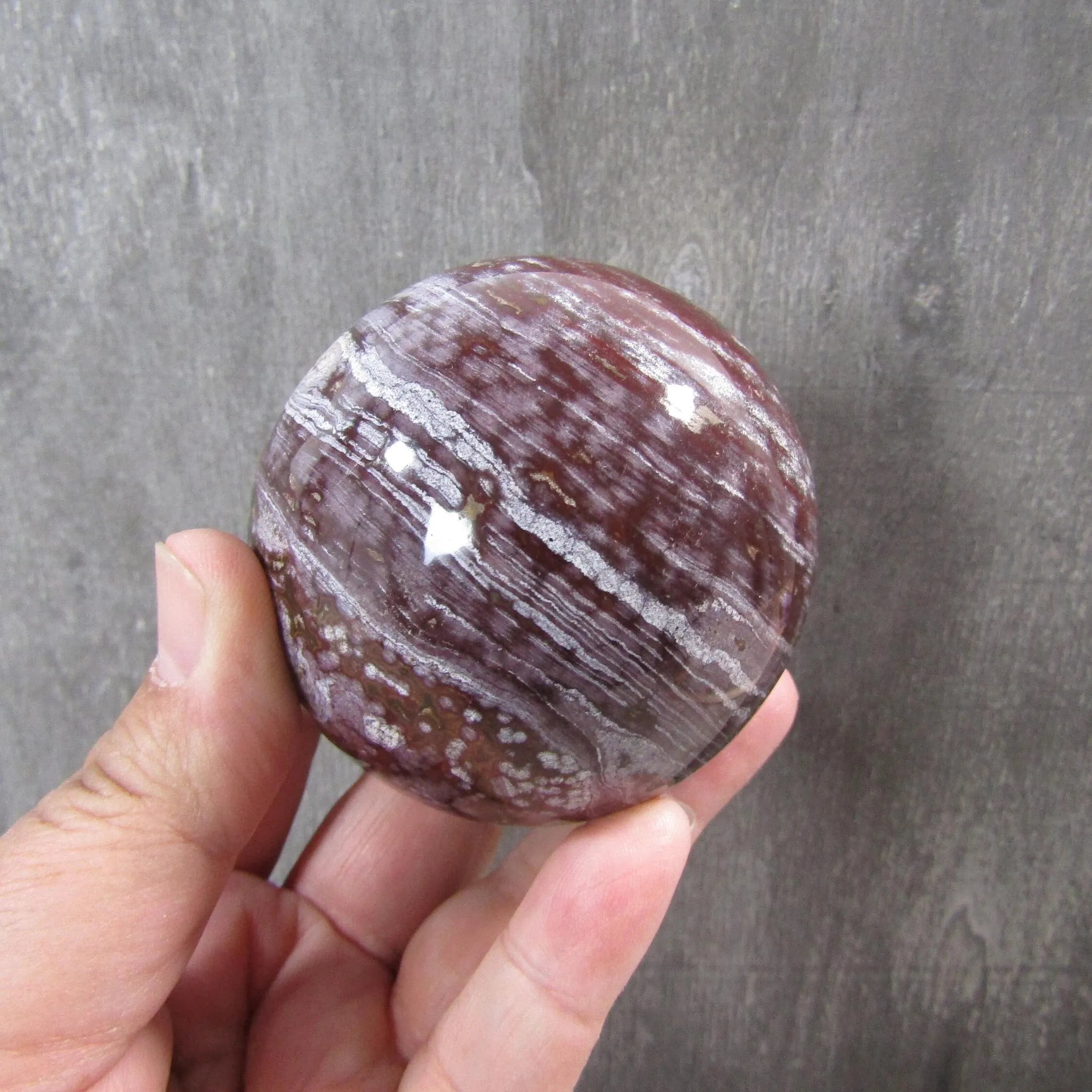 Close-up of swirling patterns in a large ocean jasper display sphere