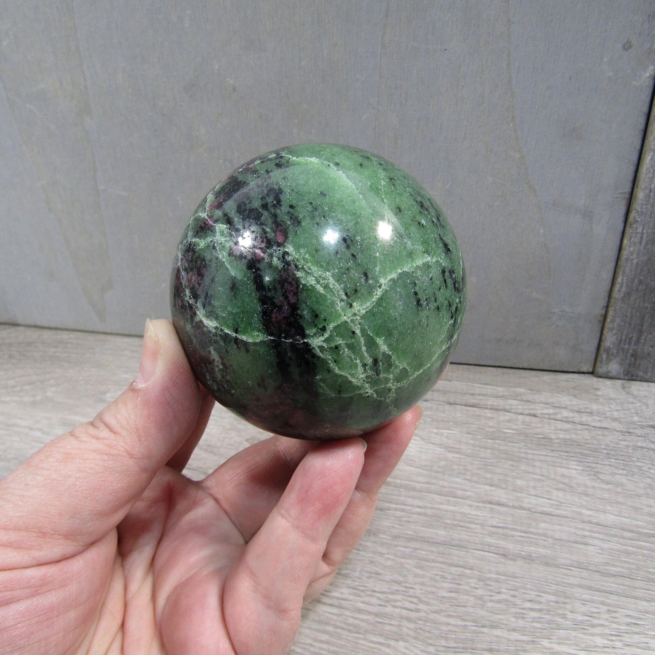 Decorative ruby in zoisite display sphere showcasing contrasting colors