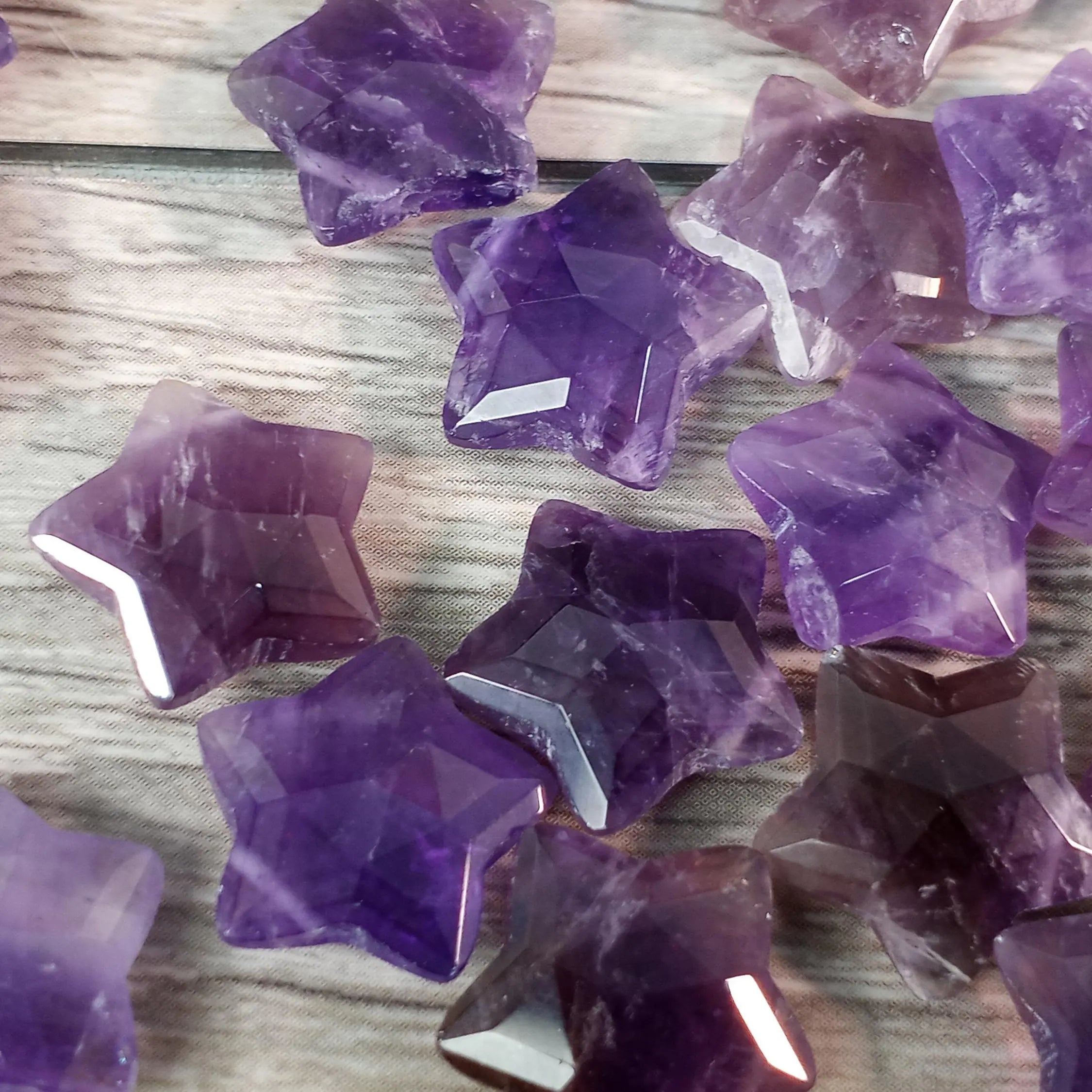 Amethyst faceted crystal star beads for resale.