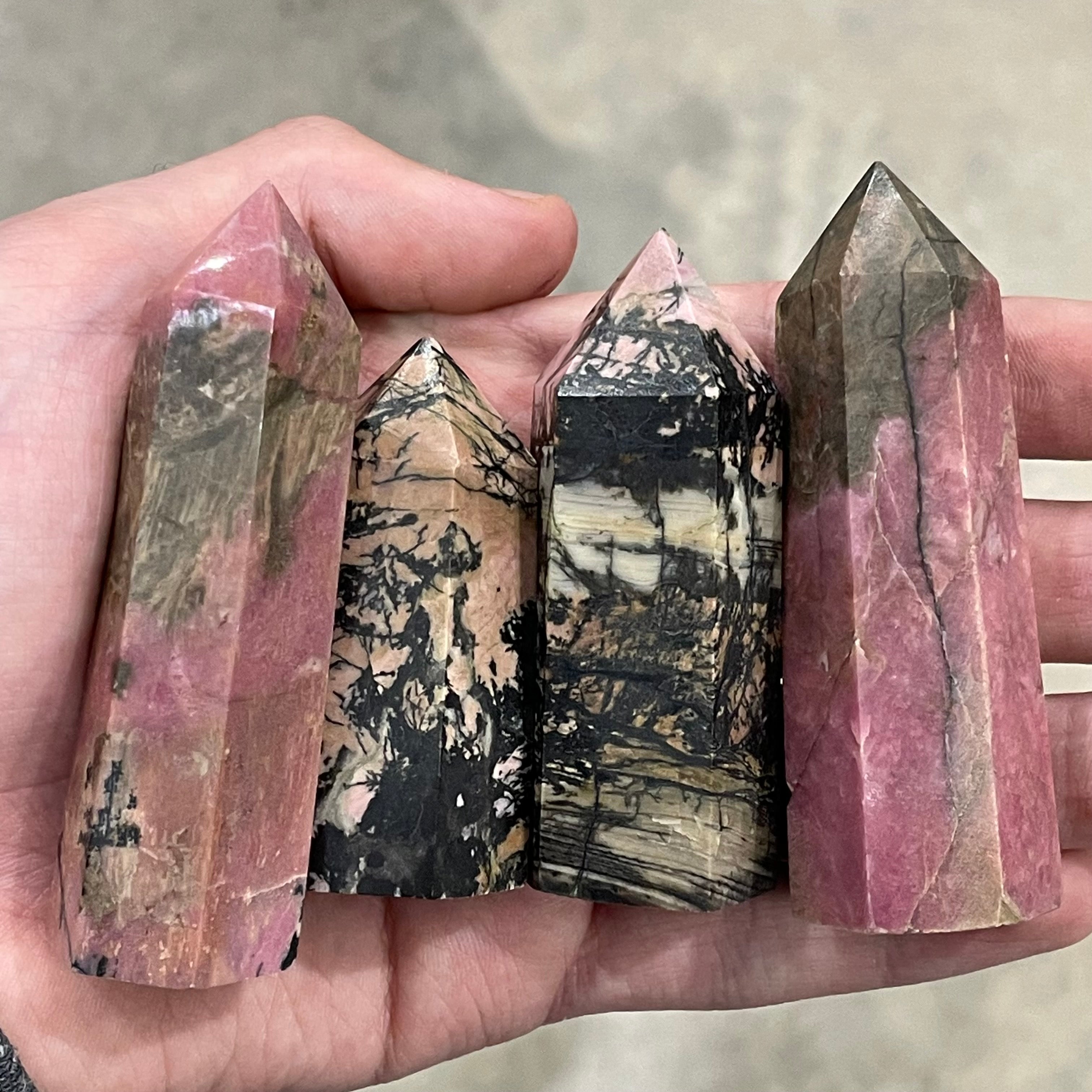 Pink and grey rhodonite obelisks for wholesale.