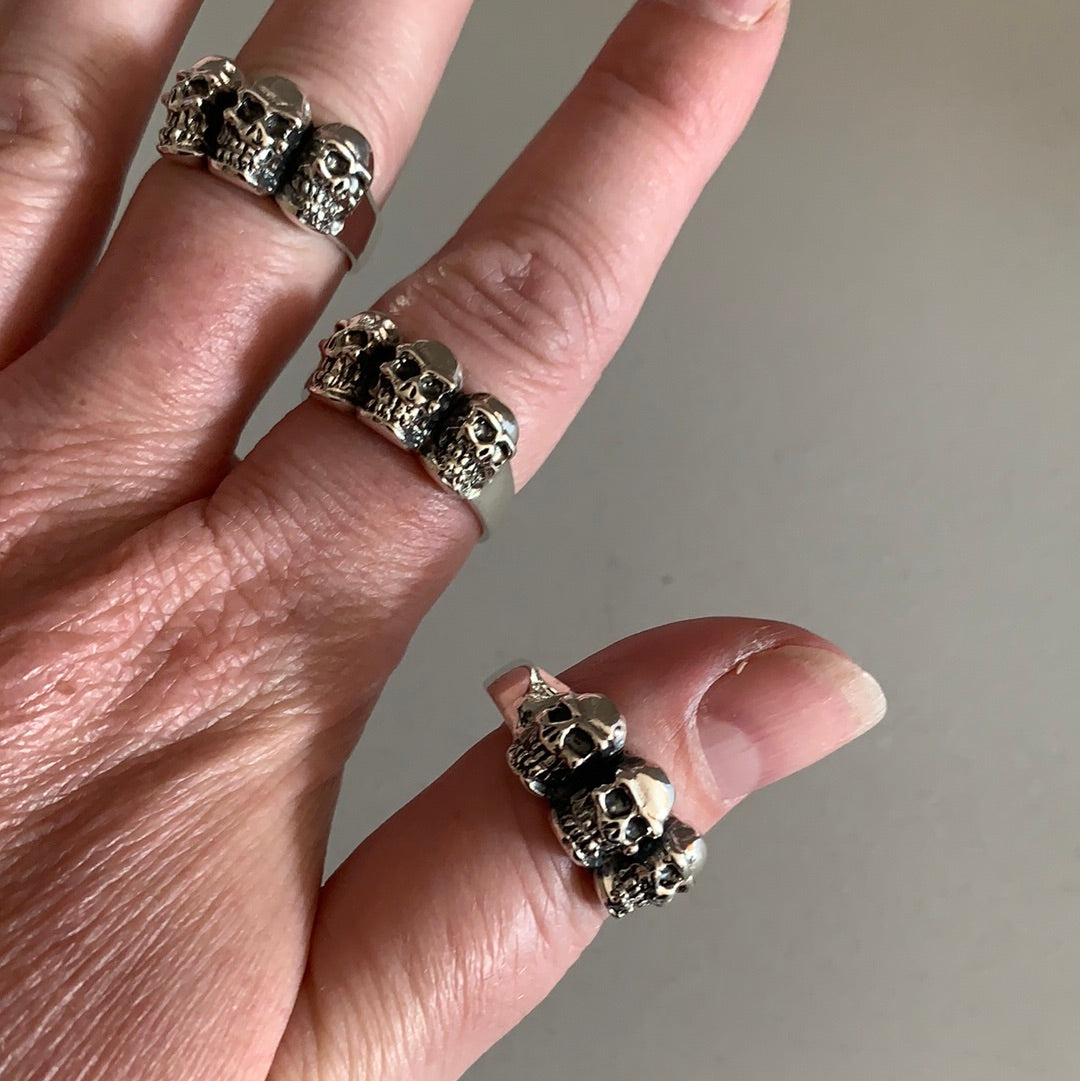 Sterling silver skull ring close-up showing rugged texture and shine