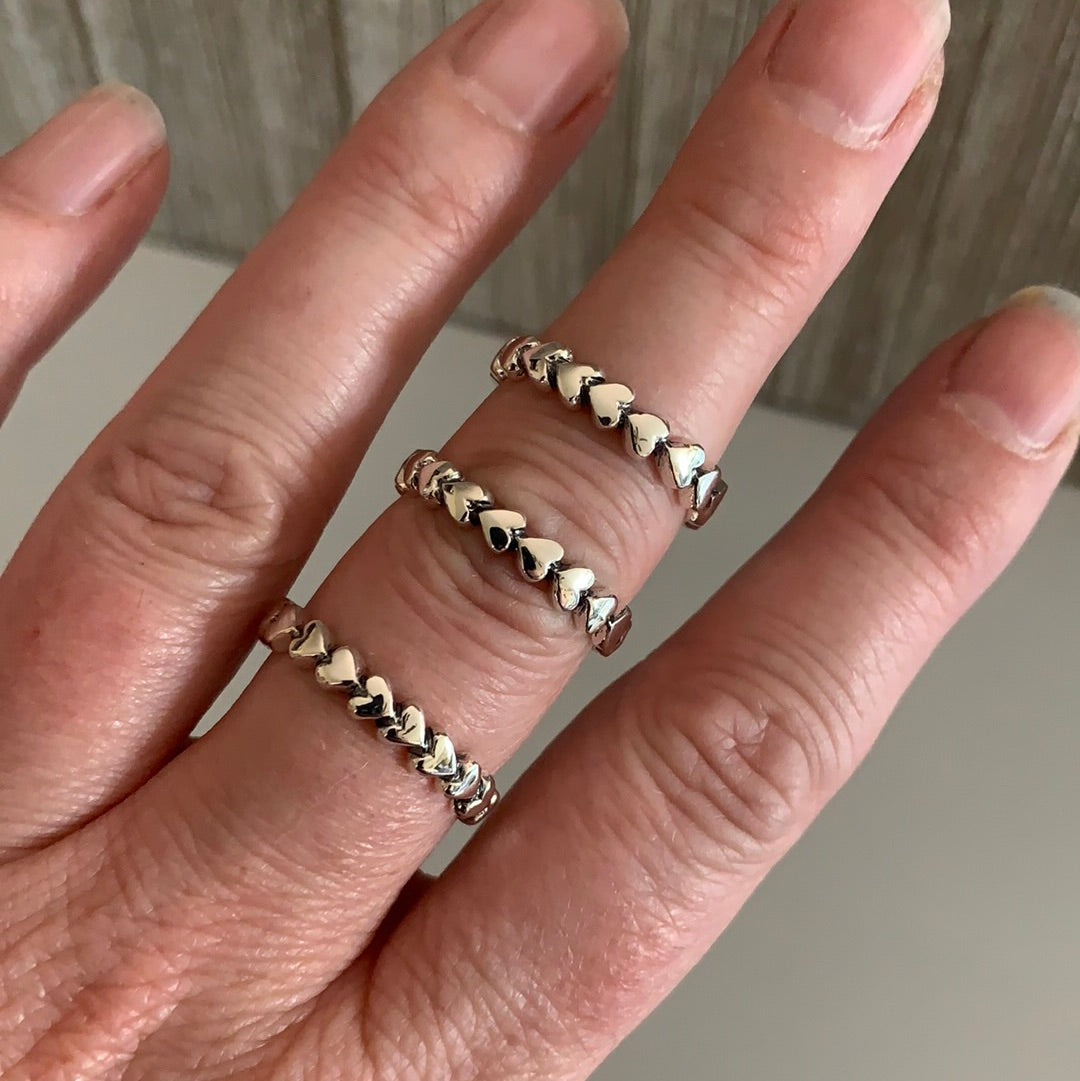 Stack of sterling silver heart rings