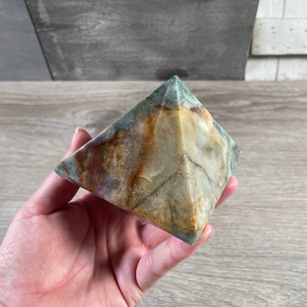 Assorted polished gemstone pyramid carvings for metaphysical and crystal stores