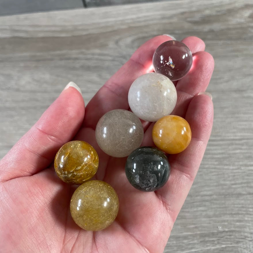 Included quartz crystal sphere with unique natural internal formations and clarity