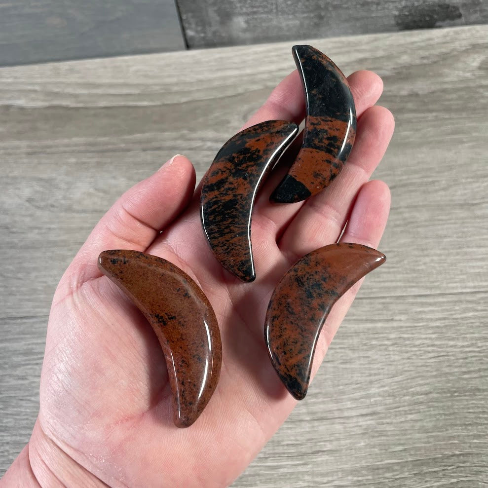 Mahogany obsidian crescent moon carvings for spiritual shops