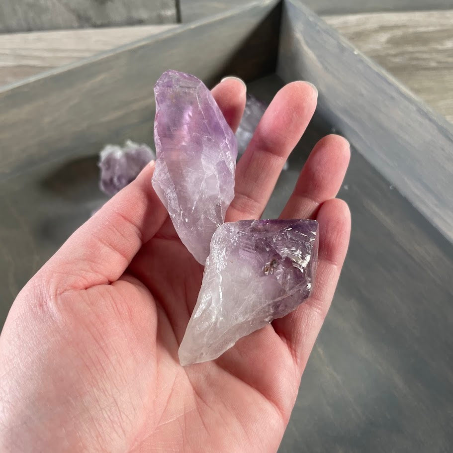 Bulk rough amethyst crystals featuring natural purple quartz points and irregular unpolished chunks
