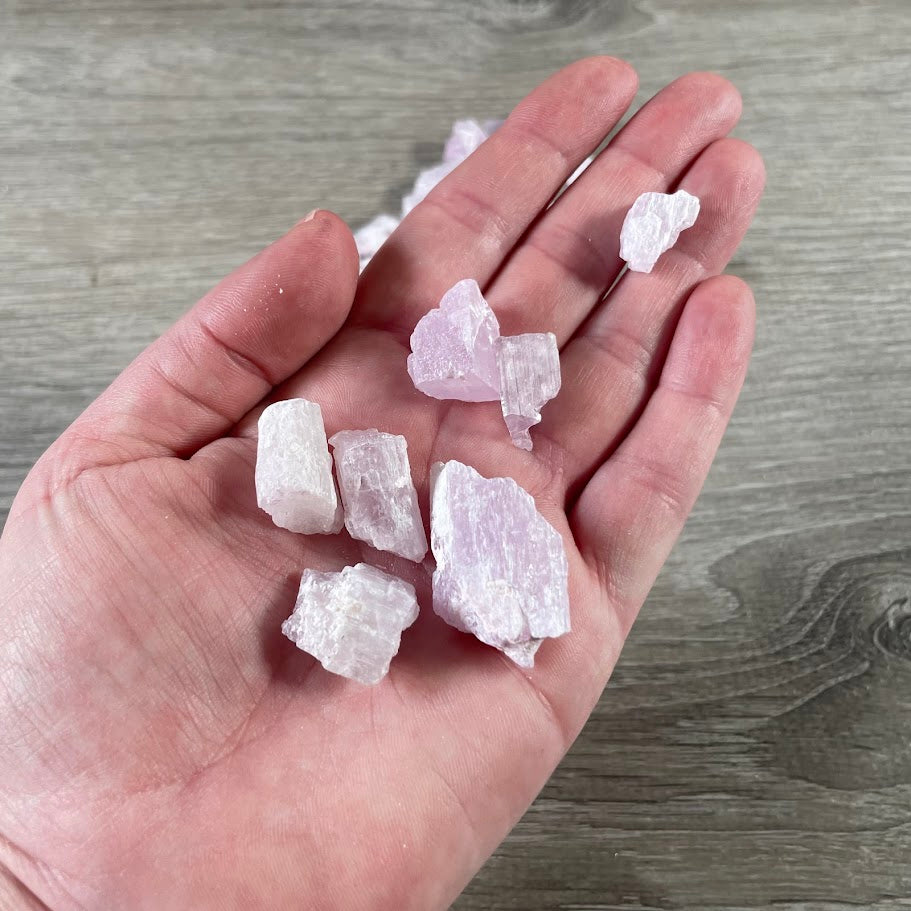 Natural rough kunzite stones sold wholesale in 4oz bulk bags