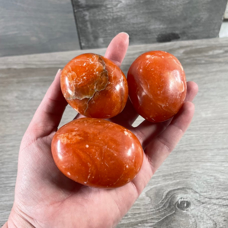 orange calcite natural gemstone palm stones wholesale crystal shop inventory