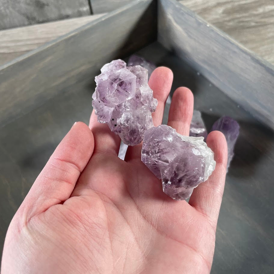 Natural unpolished amethyst points and rough purple crystal chunks sold by the pound