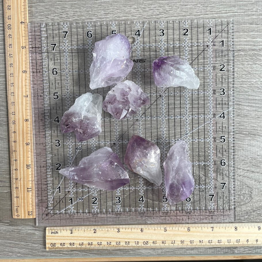 Natural raw amethyst crystal points and chunks in a 1 pound bulk wholesale gemstone assortment