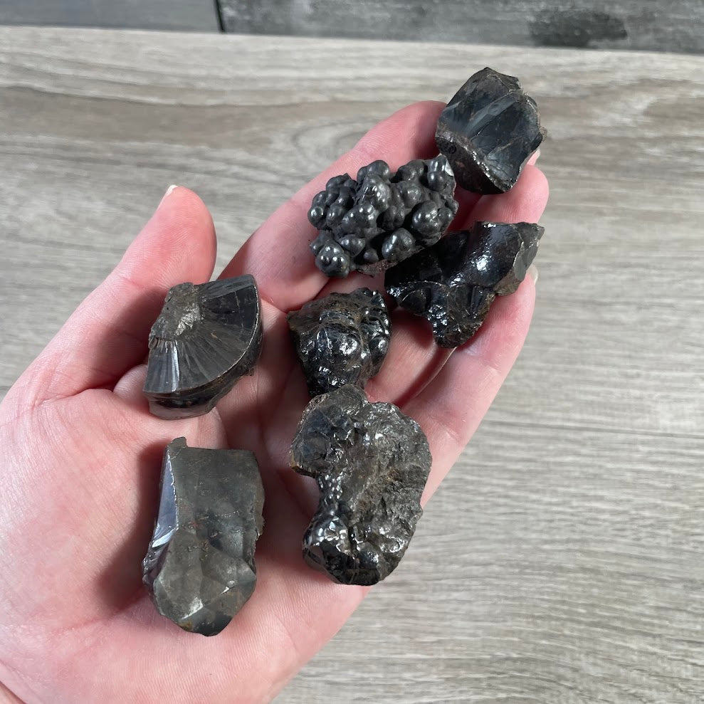 Raw hematite crystal stone with natural metallic gray mineral texture