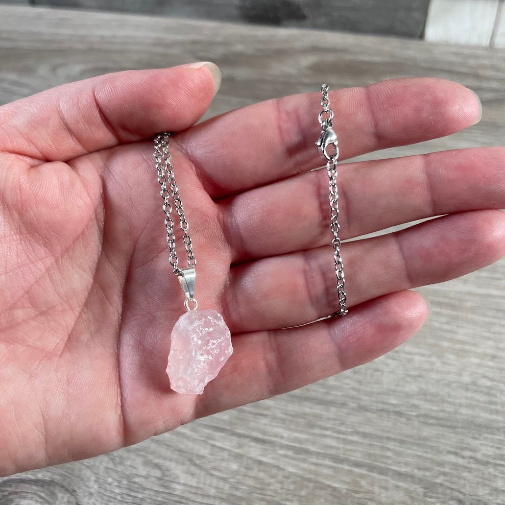 Natural gemstone pendant featuring raw rose quartz stone