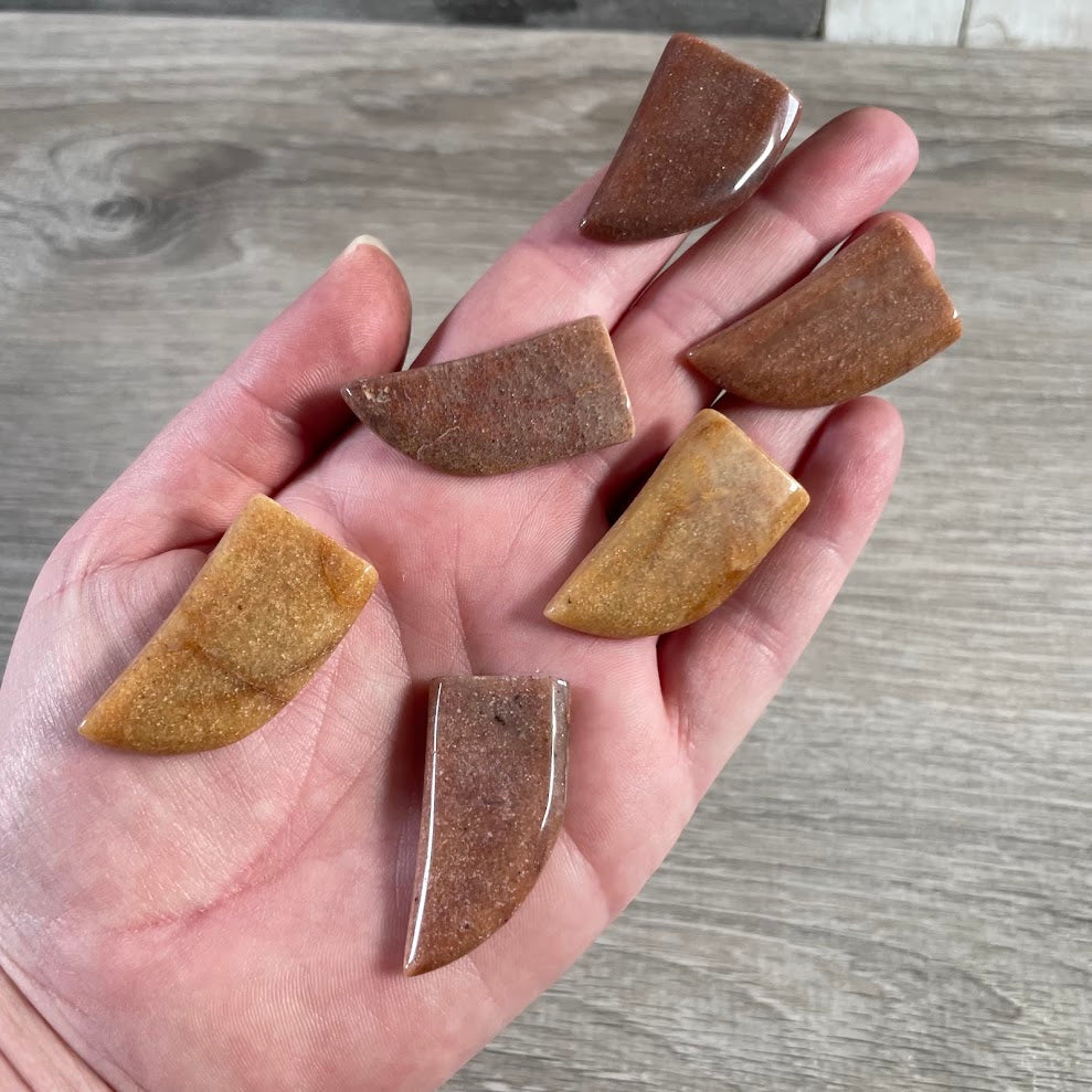 Red Aventurine gemstone animal claw carving in polished natural crystal