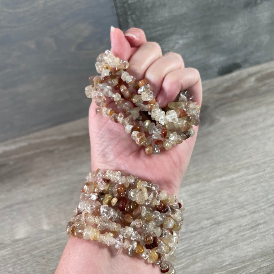 Wholesale rutilated quartz crystal chip bead bracelets featuring assorted polished natural gemstones