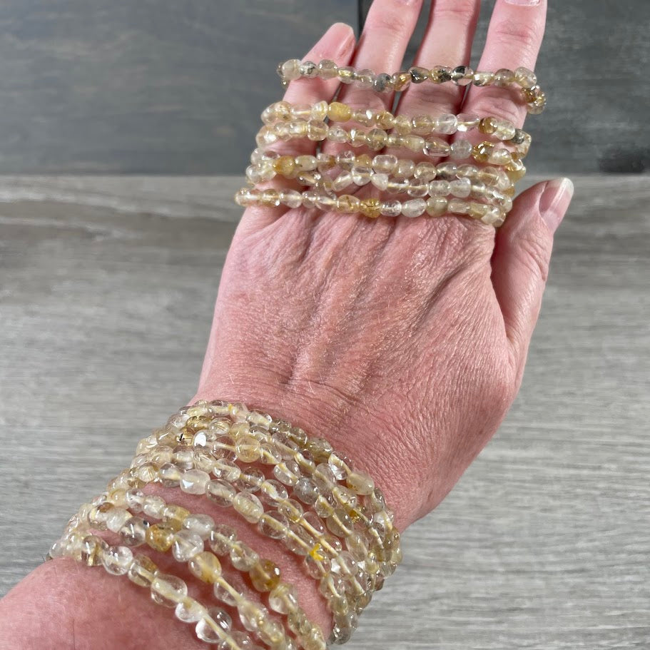 rutilated quartz gemstone stretch bracelet with polished natural crystal nuggets