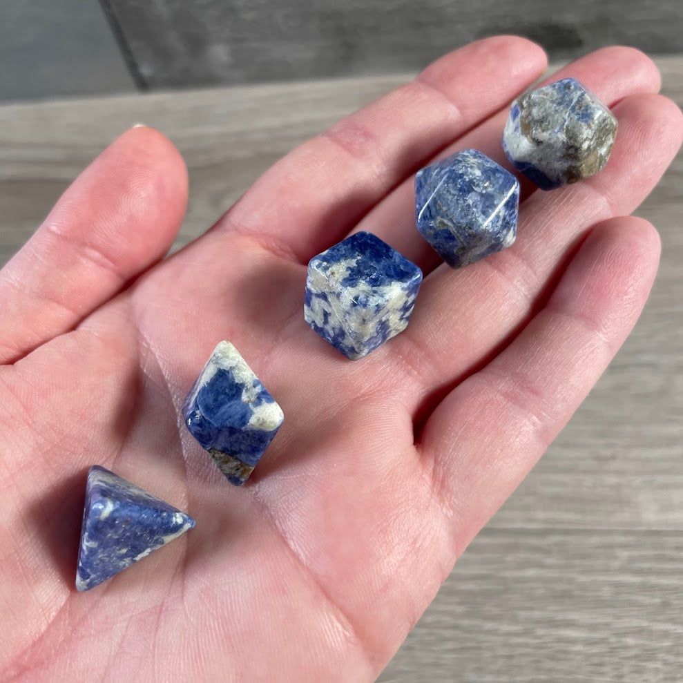Sodalite natural gemstone Platonic solid crystal set featuring polished sacred geometry shapes