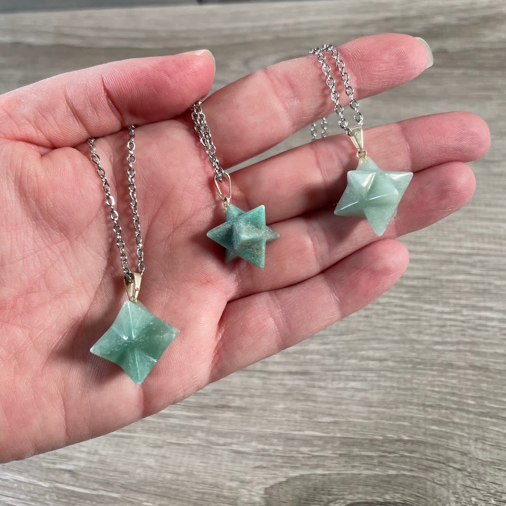 Green aventurine Merkaba necklace displayed as wholesale metaphysical crystal jewelry