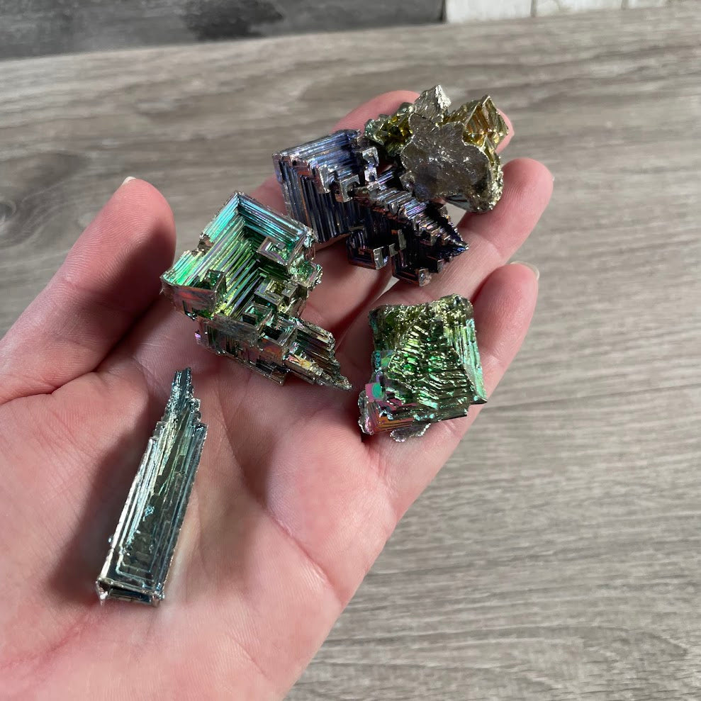 Colorful bismuth crystal with geometric stepped formation for crystal shop inventory