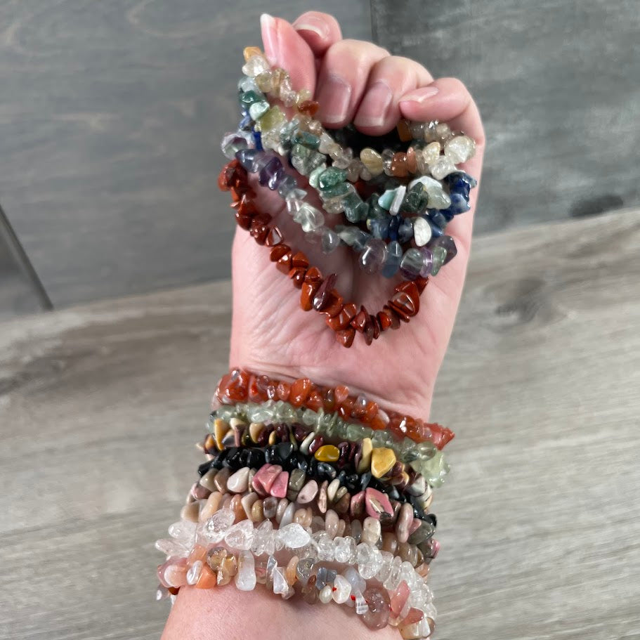 Assorted crystal chip bracelets featuring polished gemstone beads for wholesale resale