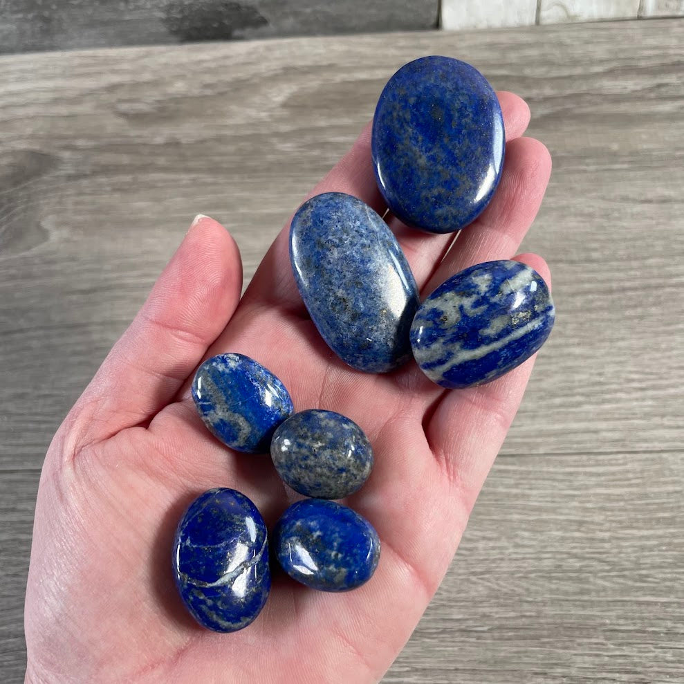 Natural lapis lazuli polished stones with rich blue gemstone coloring