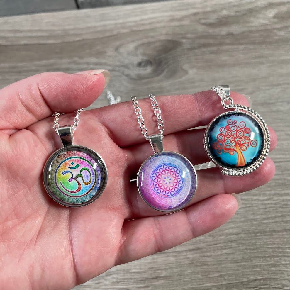 New Age assorted necklace display with mystical glass designs