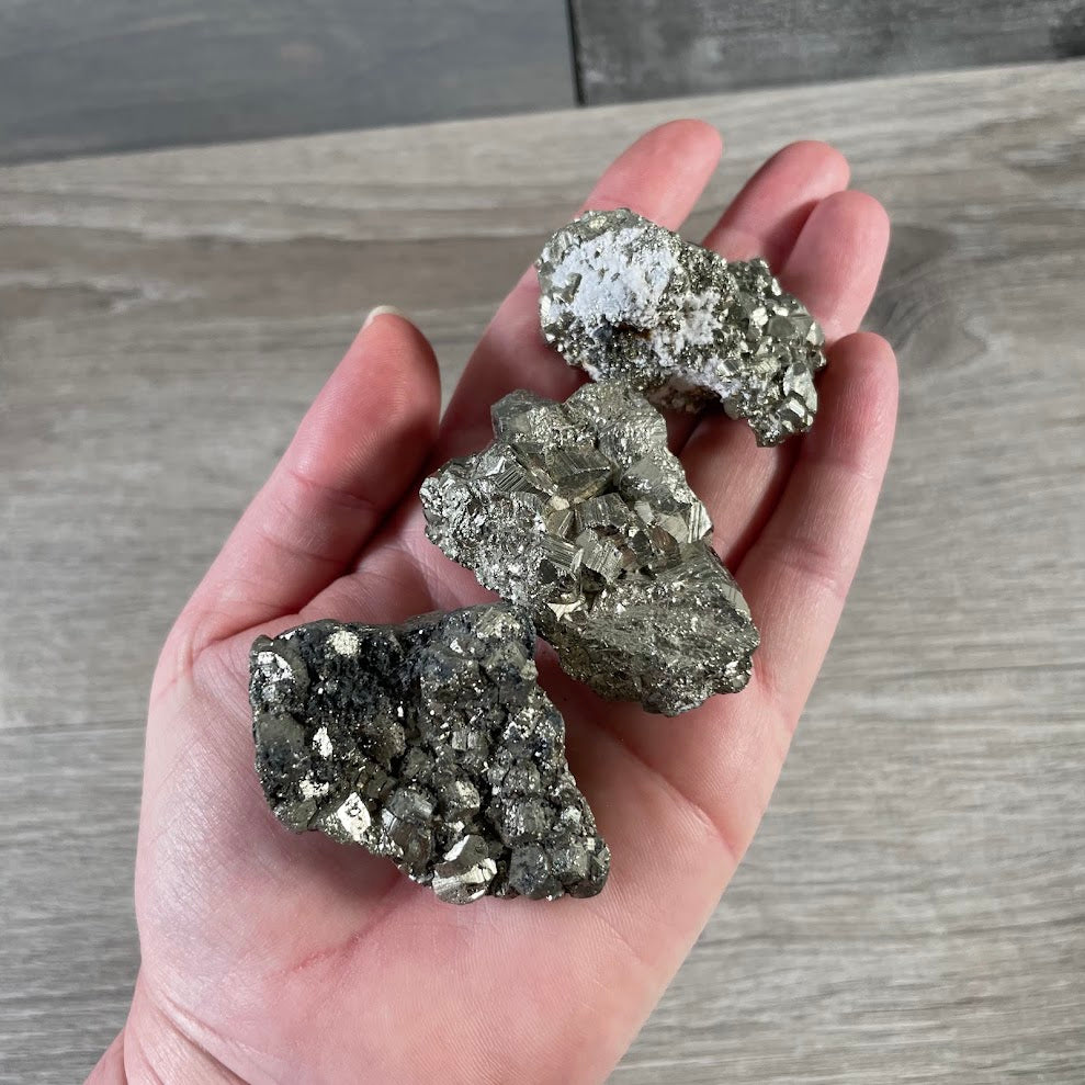 Raw natural pyrite stone cluster with geometric crystal formations