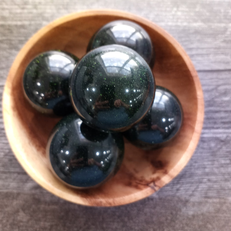 Green Goldstone Spheres