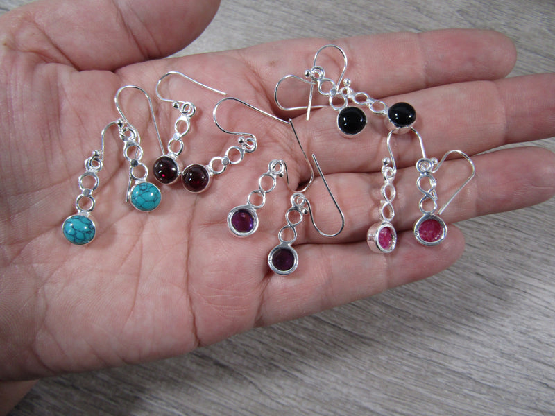 Sterling silver Earrings with four connected looops and a set crystal gemstone on the last loop