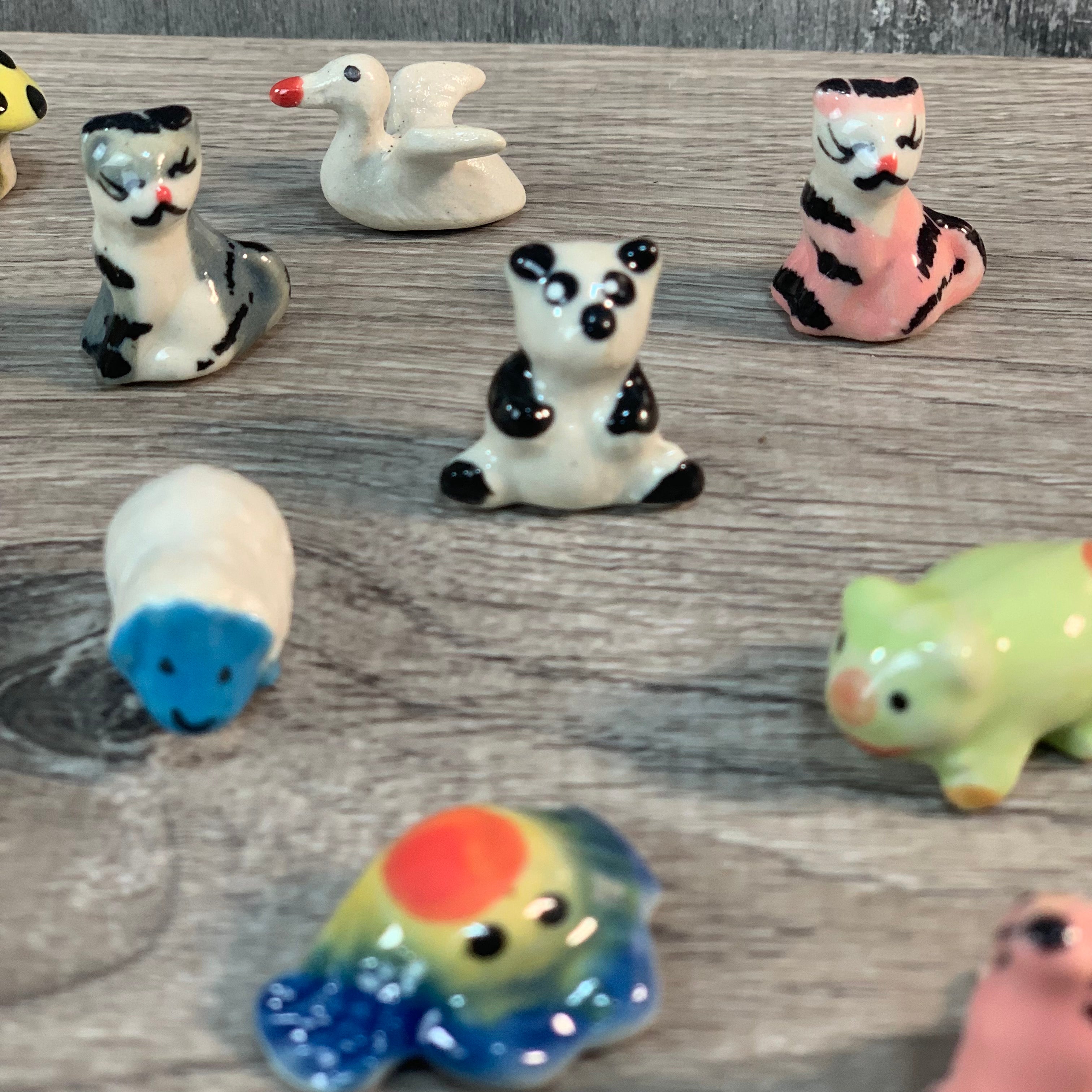 Assorted Mini Ceramic Figurines 1" set of 50