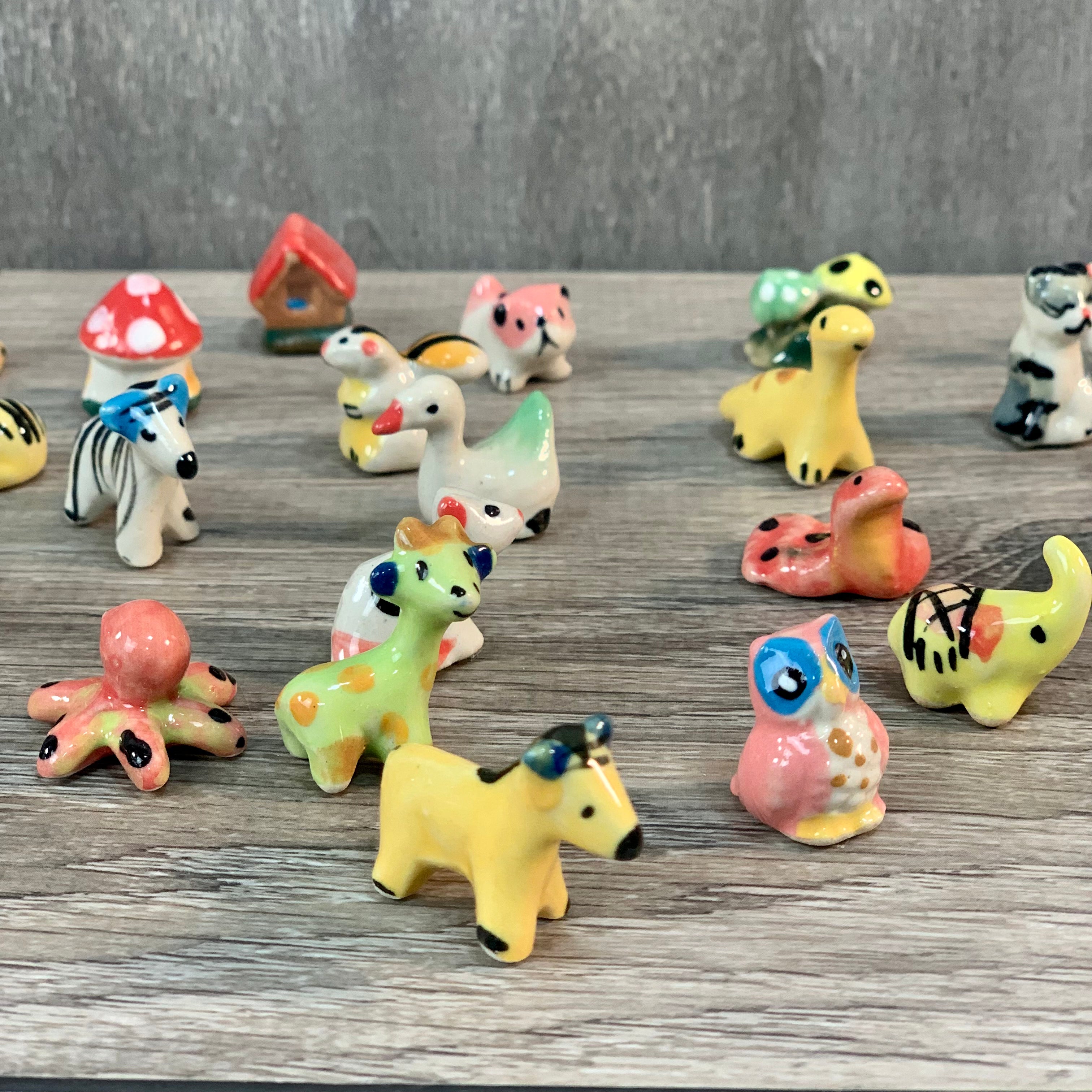 Assorted Mini Ceramic Figurines 1" set of 50